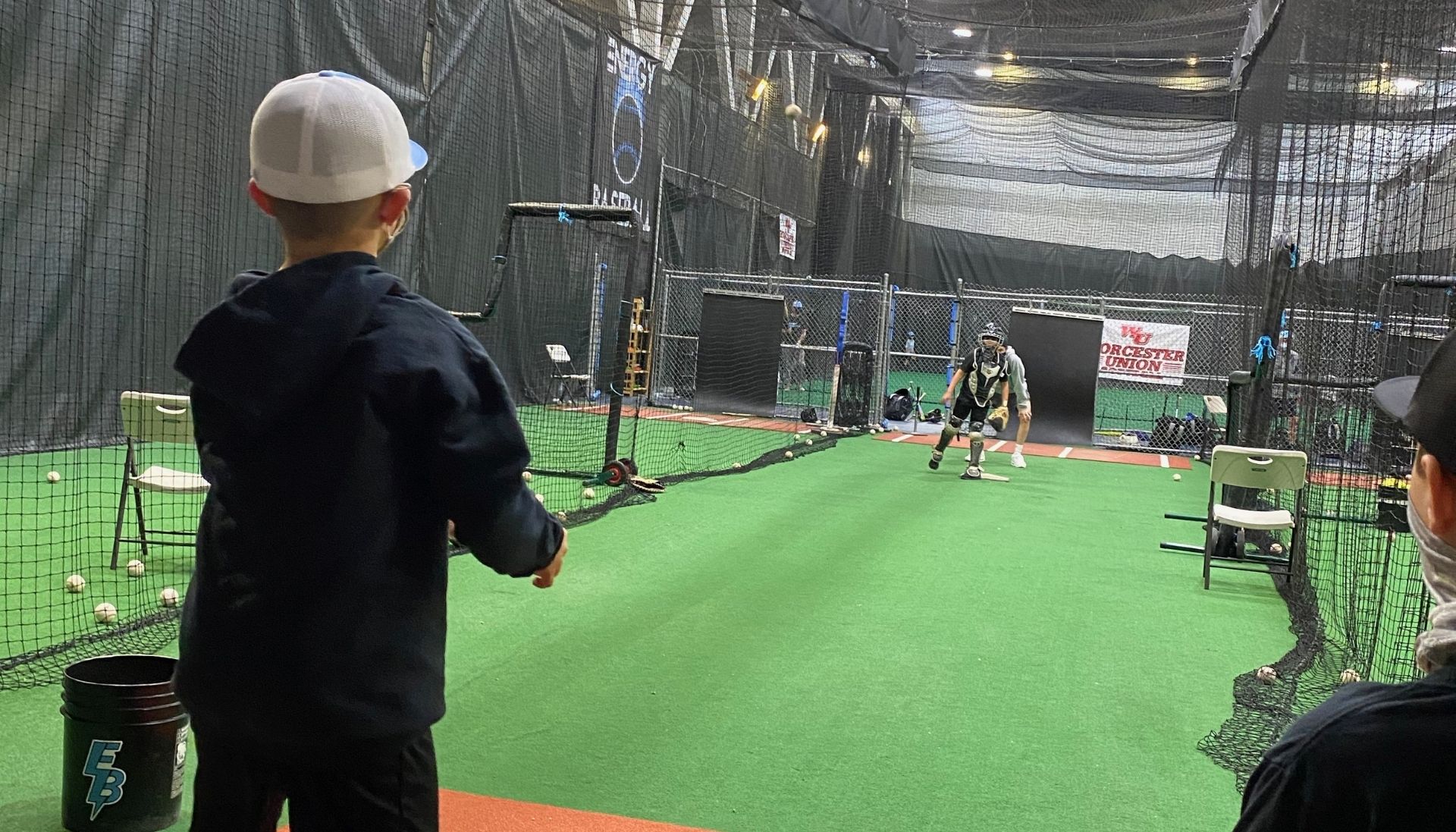 Youth baseball players training indoors at Energy Athletics